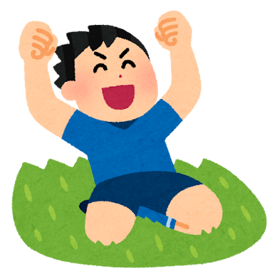 膝でスライディングをするサッカー選手